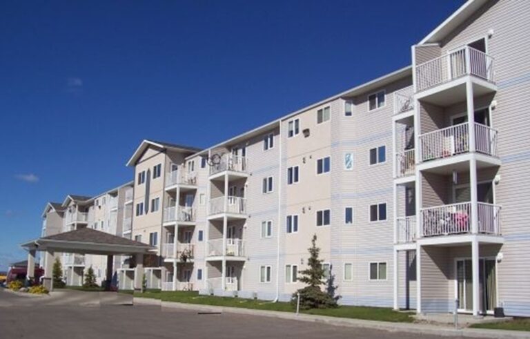 Exterior view of a multi-storey apartment building with balconies